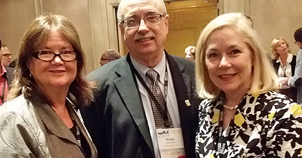 Conference Director Mary Doyle-Kimball, Chair Ralph Bivens, and Cassie Stinson gather at the opening reception.